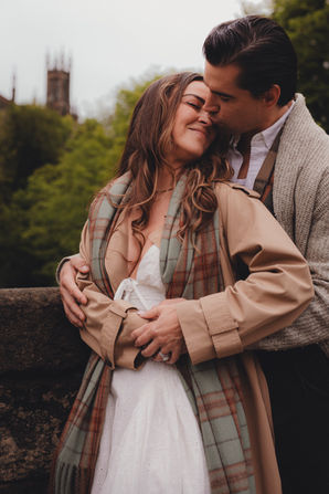 Cinematic destination couple photoshoot in Dean Village, romantic travel photography for couples visiting Edinburgh.