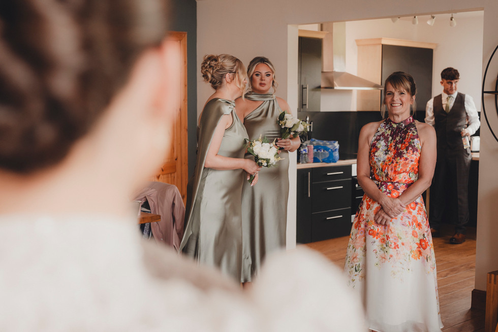 Bride getting ready in natural light during intimate Scottish wedding morning