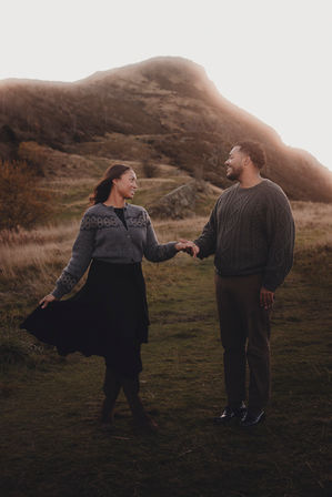 Cinematic destination couple photoshoot in Edinburgh, intimate and emotional portrait in a natural Scottish landscape. Holyrood