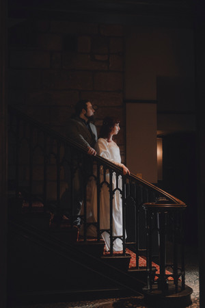 Bride and groom portraits inside Dalhousie Castle with cinematic castle atmosphere