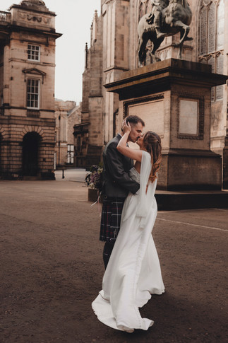 Bride and groom portraits outside St Giles Cathedral, Edinburgh, cinematic wedding photography