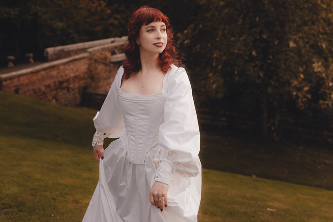Bride and groom walking through autumn forest during Dalhousie Castle elopement