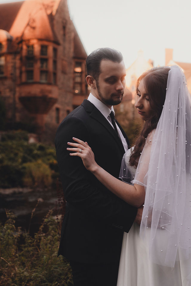 Edinburgh wedding photographer capturing a couple’s romantic elopement along the historic streets of Dean Village.