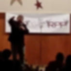 Roger Peterson With Mic On Stage 4