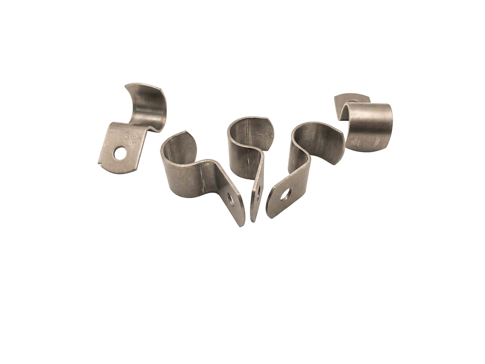 Studio photography of several metal cable clamps arranged on a white background. The clean, industrial aesthetic suggests precision and hardware utility.