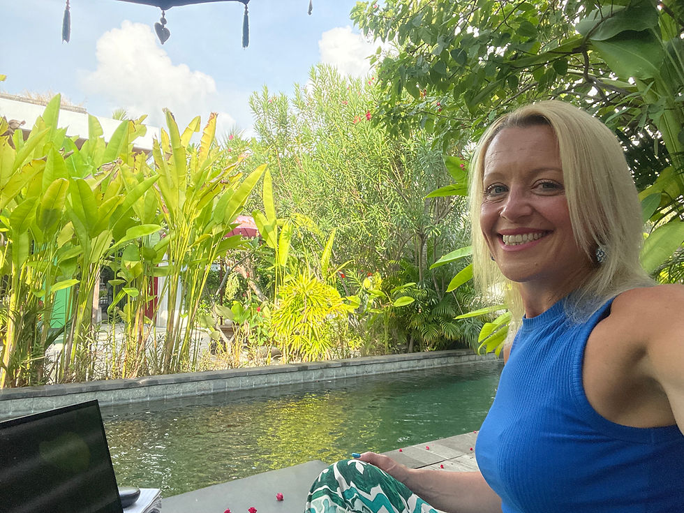 Mehalah Beckett, executive coach and founder of Lead Powerful Impact, reflecting on meaningful work, purpose and leadership while working remotely beside a tropical pool during business travel