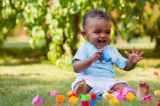 Baby-playing-outside-day-nursery-in-Kilburn-London-1-1170x780.jpg