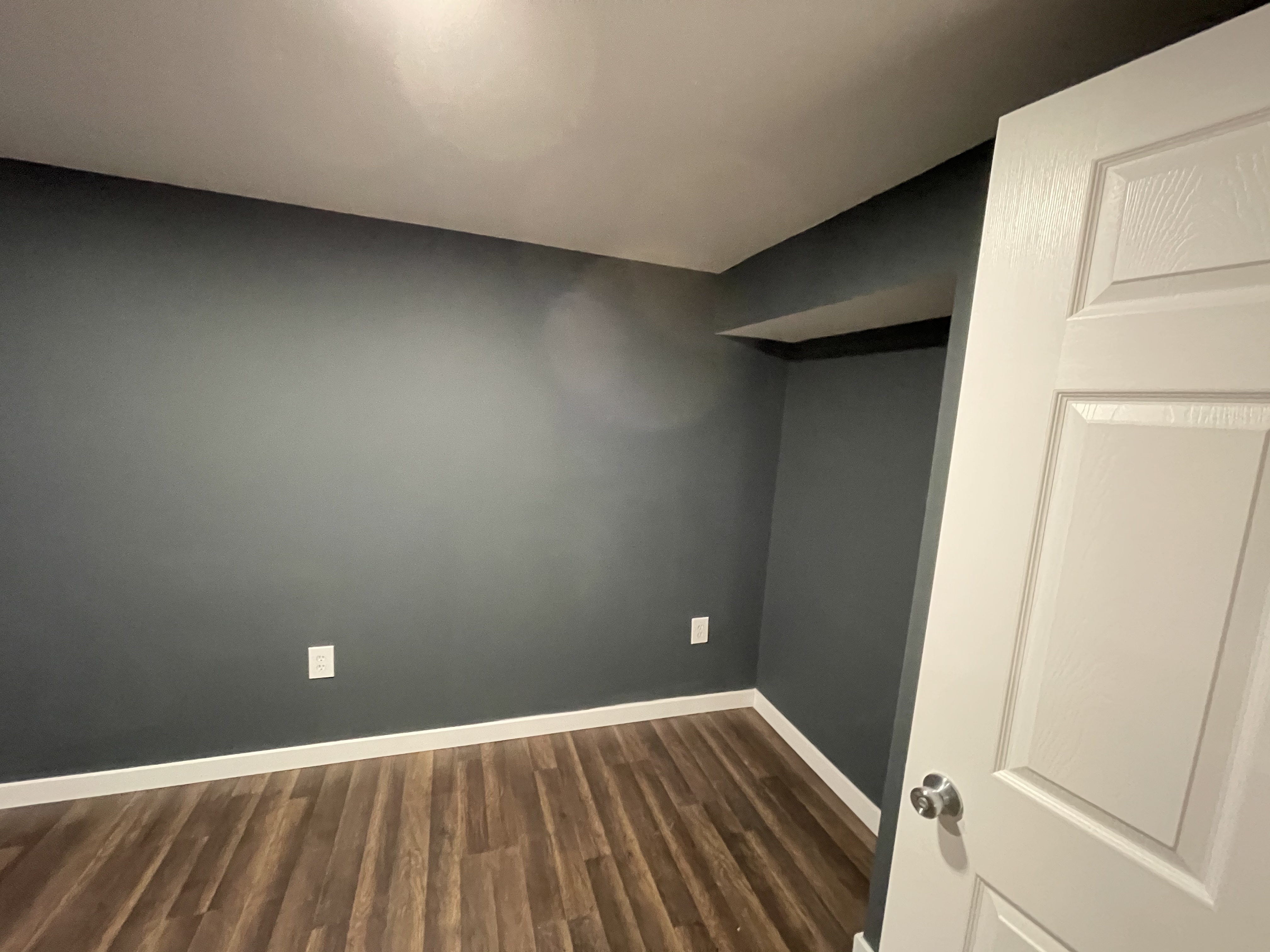 Example of a finished basement living area by Mankind LLC