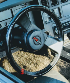 Corvette steering wheel with black leather and red stripe