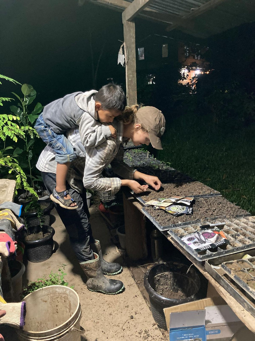 Above: Santi helping me plant starts. 