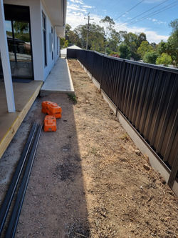 Work in progress colourbond fencing panels. With plints in monument colour.