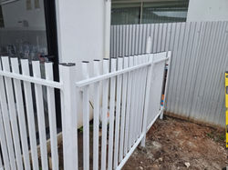 Pool fencing ready for artificial turf installation.