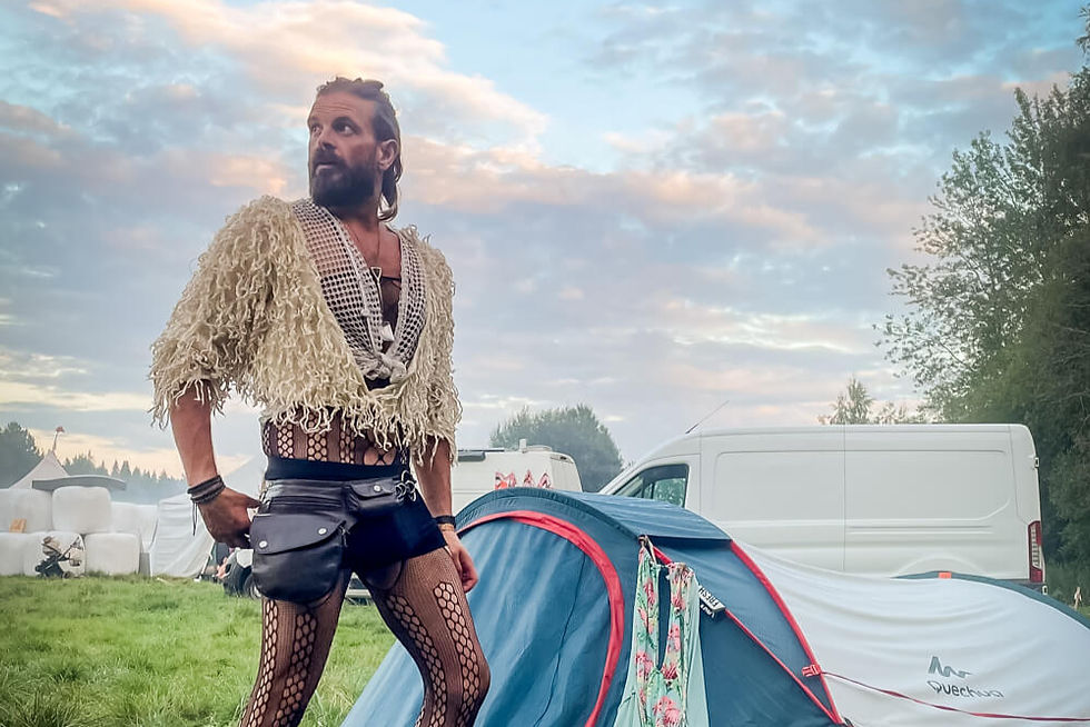 A men's festival outfit styled with black and white clothing