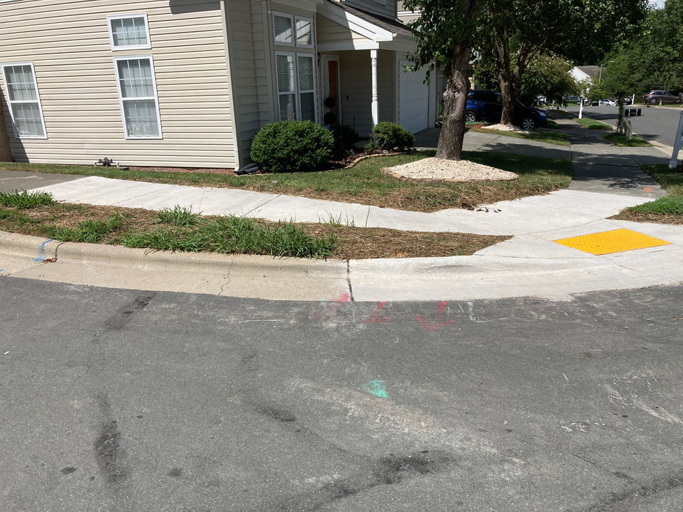 An image of a compliant city curb ramp.