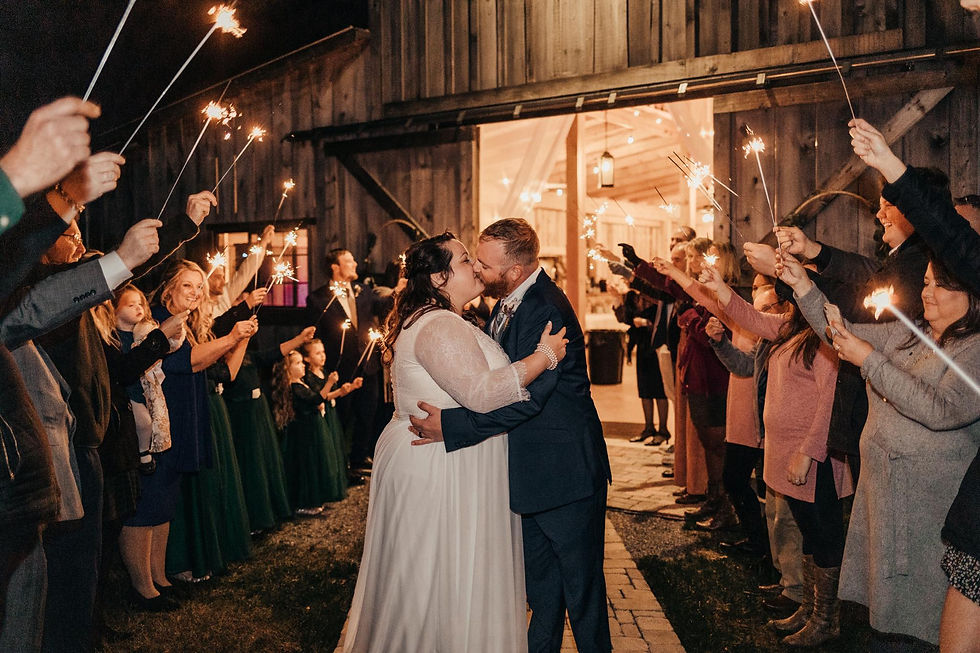 Newlyweds kiss during their nighttime sparkler send off at Cedar Hills Farm, a wedding venue near Chattanooga, TN