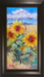 three big sunflowers amongst an abstract yellow sunflower field