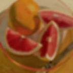 still life of a citrus orange cut up