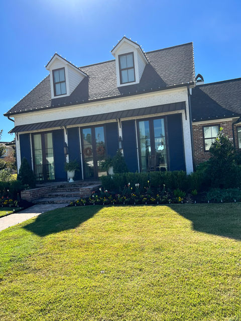 french doors and doormers with a brick face