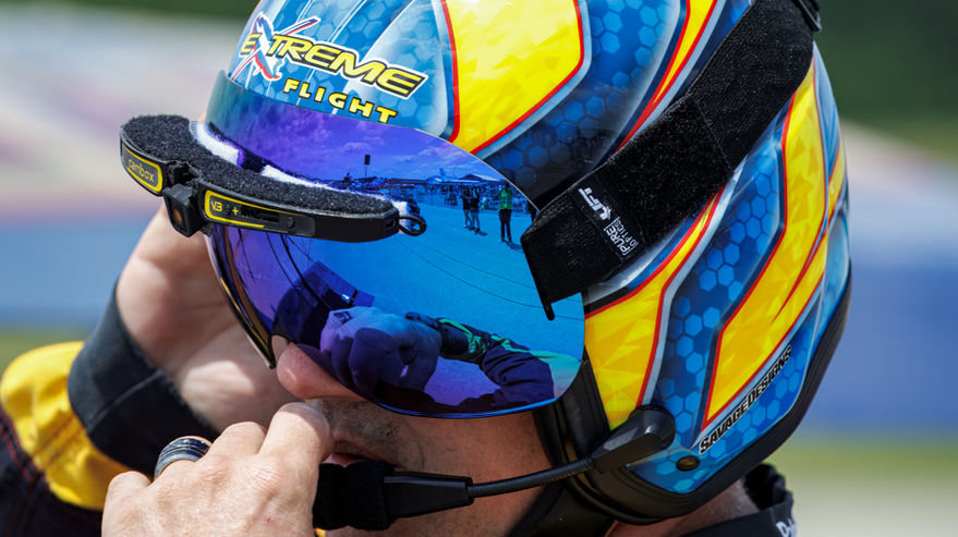 Close-up of professional airshow pilot Patrick McAlee adjusting his Lift helmet before flying his Pitts S1S aerobatic aircraft at the Latrobe Westmoreland Airshow  Extreme Flight Airshows.