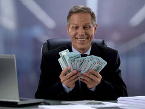 Private equity exec smiling at all of the money they have made. Photo credit: Motortion Films