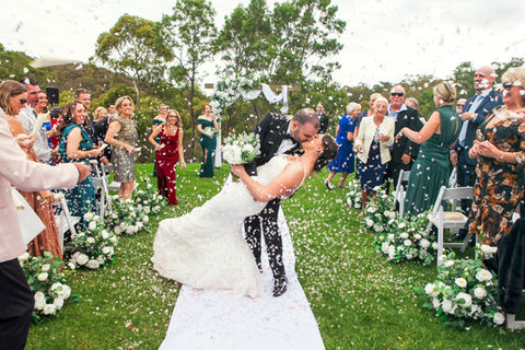 Dramatic aisle kiss post Ceremony at Farm Vigano