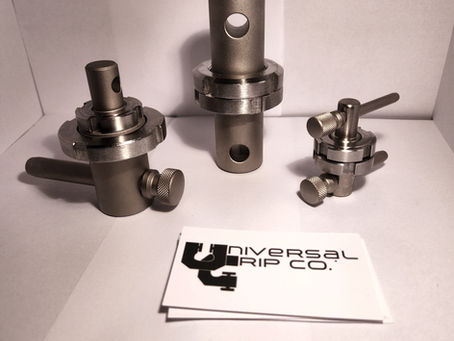 Comparison of small, medium, and large grip adapters for universal testing machines. Used for connecting grips and fixtures to UTMs ranging from low-force lab equipment to high-capacity industrial systems.