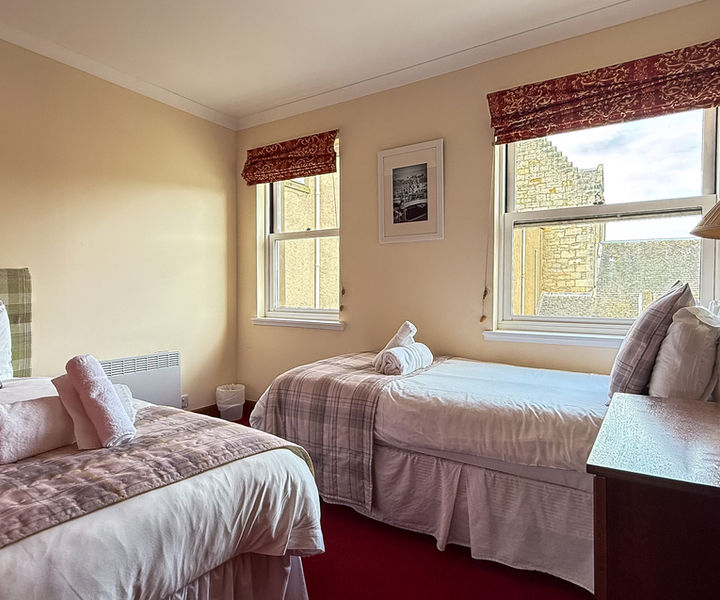Twin bedroom in a 3 bedroom townhouse at Kilconquhar Castle Estate, one of two twin rooms suitable for families and groups.