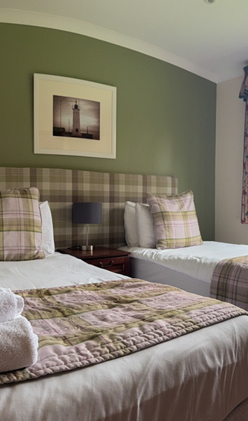 Twin bedroom with two single beds in a 3 bedroom villa suitable for families or groups.