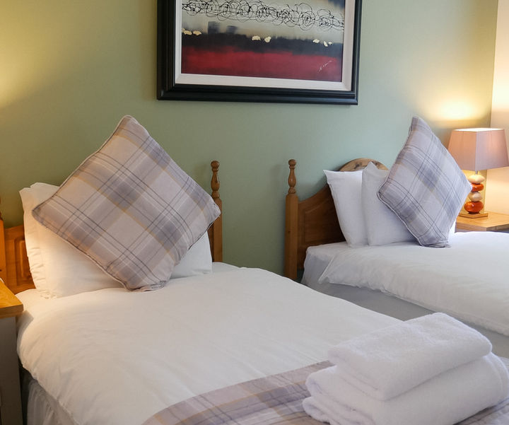Twin bedroom in Rose Cottage, ideal for families or friends, located approximately 10 minutes walk from the estate leisure facilities and restaurant.