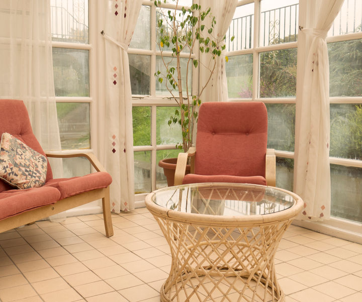 Bright conservatory seating area in Garden Apartment at Kilconquhar Castle Estate