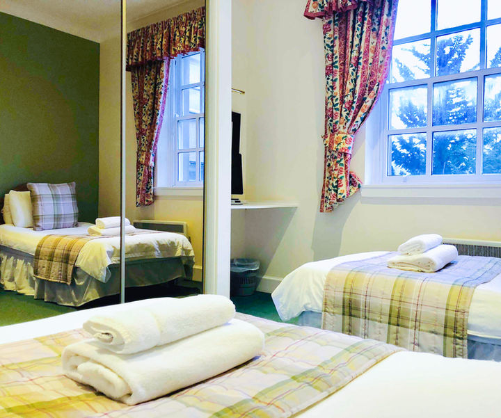 Twin bedroom with soft furnishings in 2 bedroom apartment at Kilconquhar Castle Estate