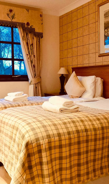 Bedroom in a 3 bedroom villa with sauna sleeping up to 8 guests, with flexible double and twin room layout.