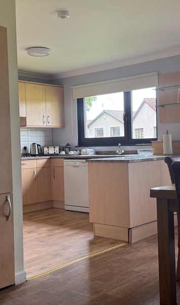 Open plan kitchen and dining area in a 2 bedroom villa at Kilconquhar Castle Estate for self-catering stays.