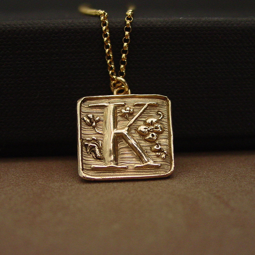 K initial necklace on box