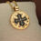 Thumbnail: Occitan cross pendant necklace on pillow