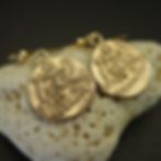 Mycenaean goddess earrings on coral