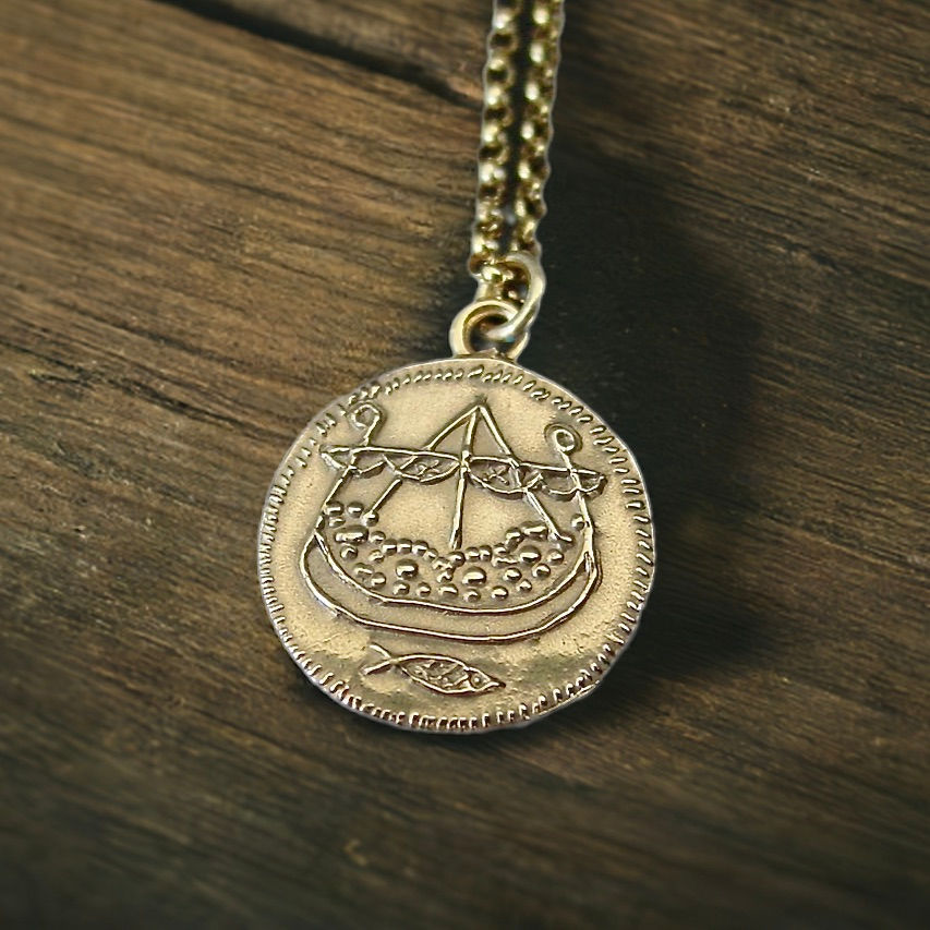 Viking longship coin necklace close up