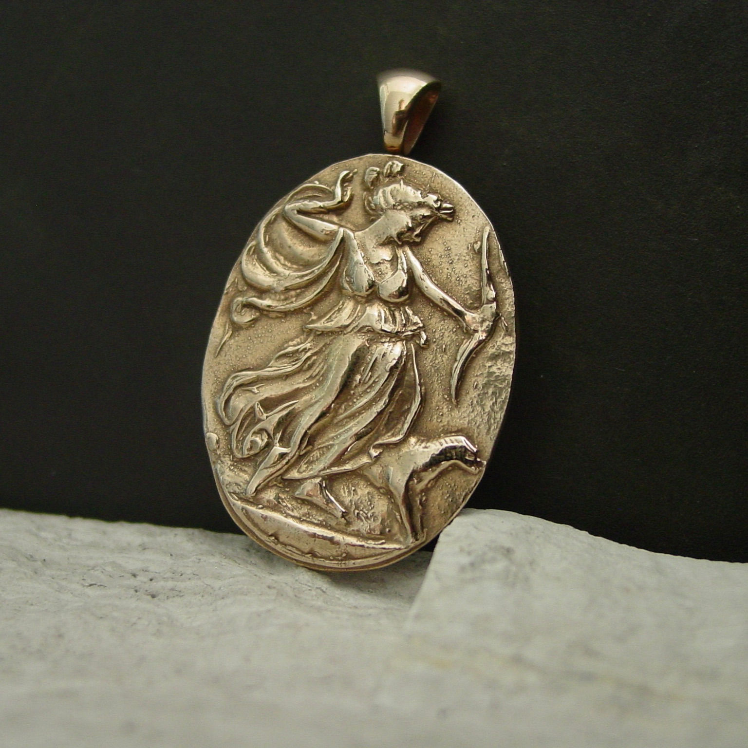 Artemis pendant necklace on limestone