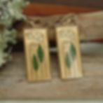 Lily of the valley earrings on green moss