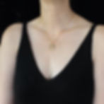 J letter necklace on woman