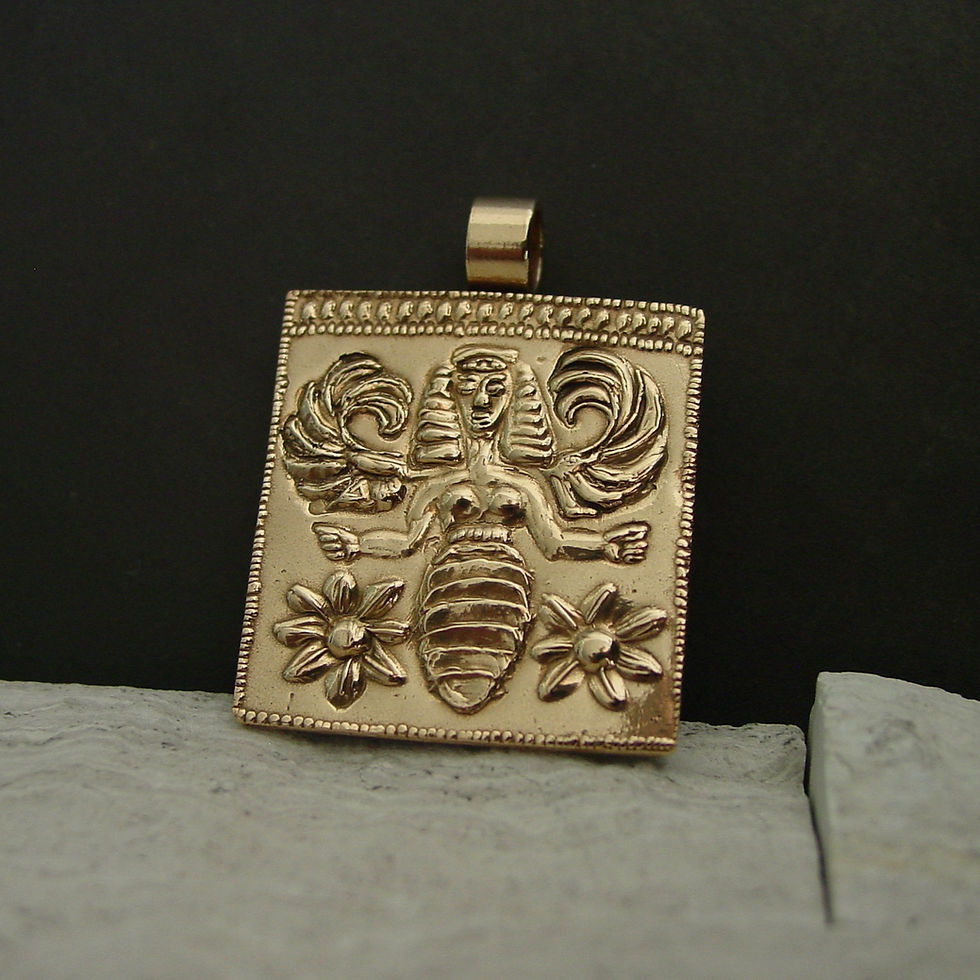 Minoan bee goddess pendant on limestone
