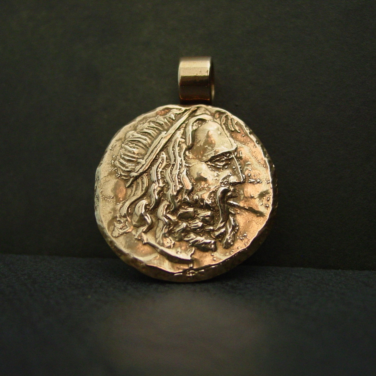 Poseidon pendant on slate