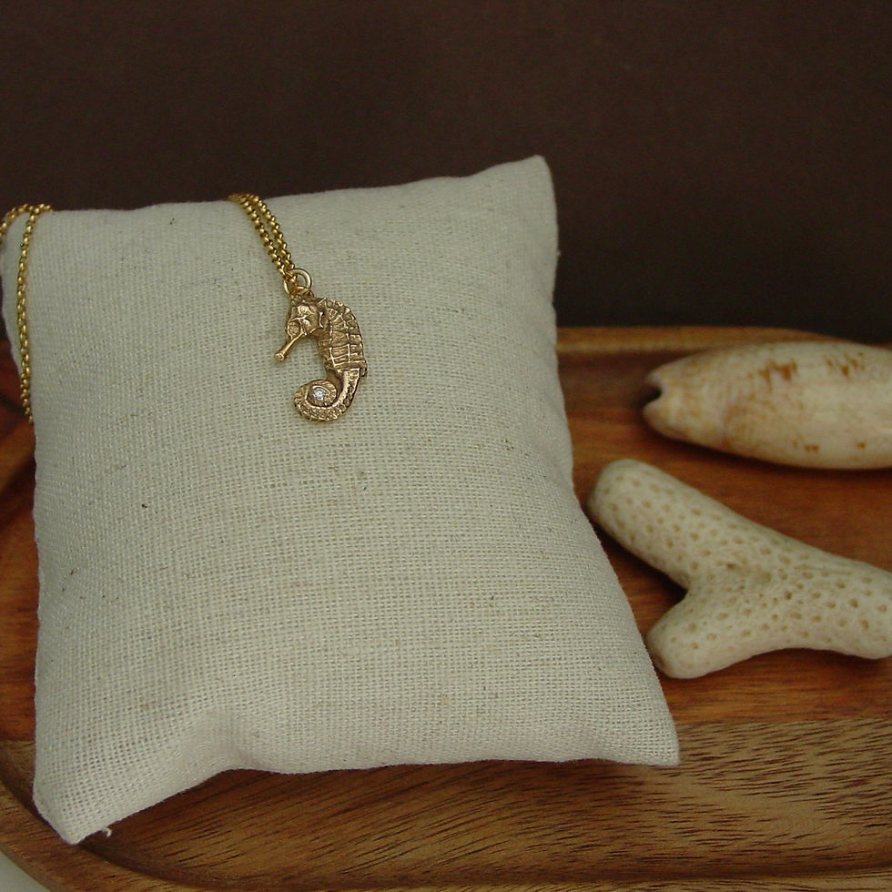 Thumbnail: Seahorse necklace on props