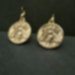 Bee coin earrings on slate