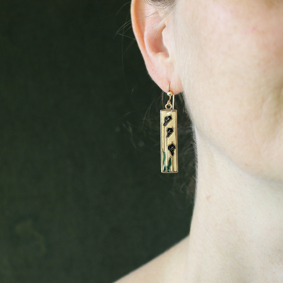 Black cala lily earrings on woman