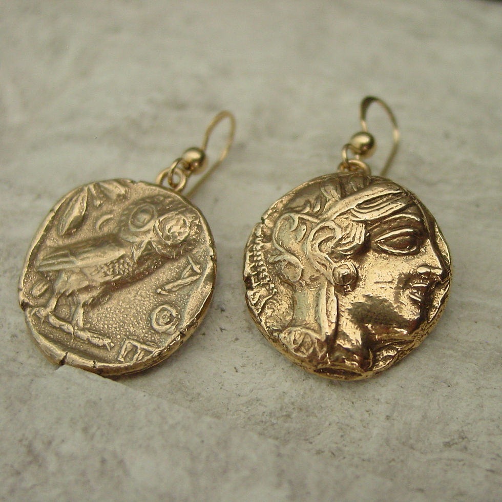 Thumbnail: Owl and Athena earrings on limestone