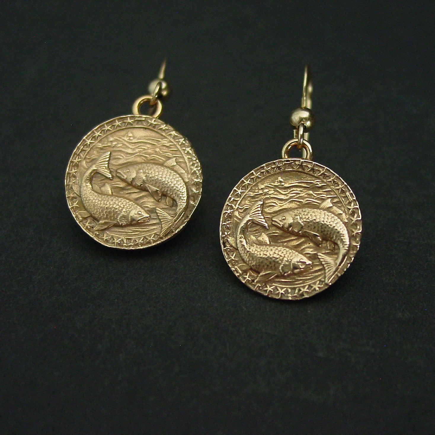 Zodiac Pisces earrings on black background