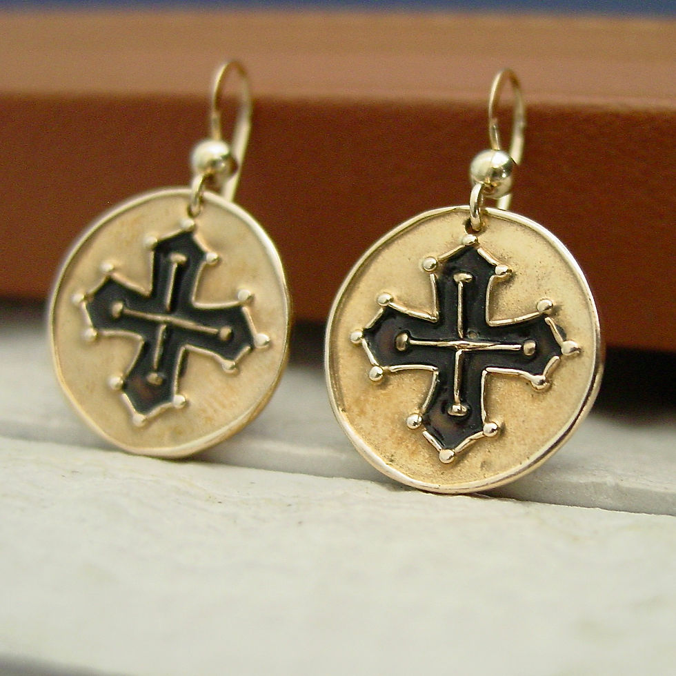 Occitan cross earrings on notebook