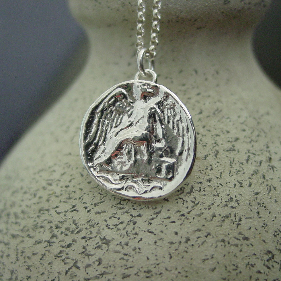 Thumbnail: Silver nike coin necklace on vase
