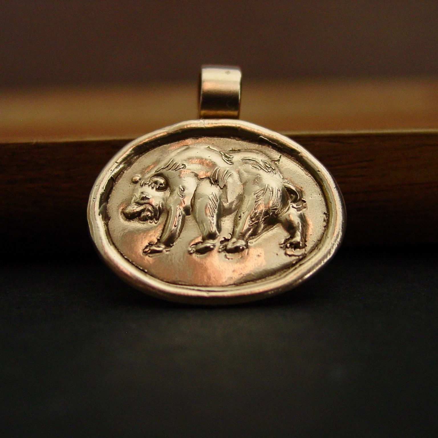 Black Bear pendant in front of tray